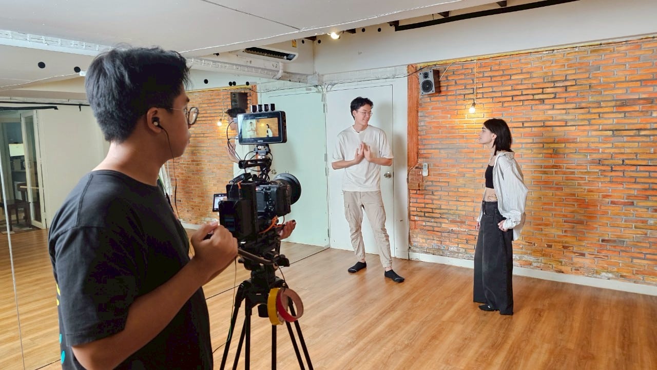 Professional Bangkok film set with actors and crew working seamlessly, showcasing industry standards.  

